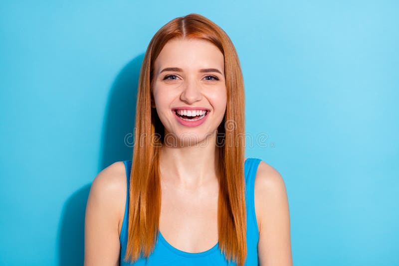 Photo portrait red haired woman smiling wearing casual outfit isolated pastel blue color background stock images