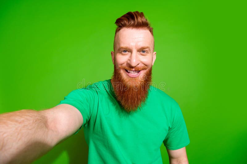 Photo of Positive Cheerful Man with Ginger Beard Dressed Green T shirt