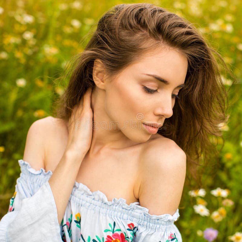Photo of pretty brunette woman in chamomile field royalty free stock photography Photo of pretty brunette woman in chamomile field royalty free stock photography