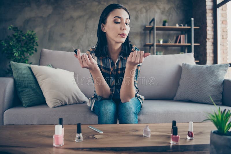 Photo of pretty lady made correction finger nails applying final polish coat blowing helping dry wear casual clothes royalty free stock photos Photo of pretty lady made correction finger nails applying final polish coat blowing helping dry wear casual clothes royalty free stock photos
