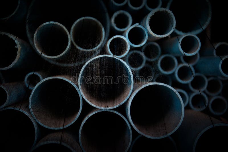 Photo PVC pipes stacked on old wooden board. Photo PVC pipes stacked on old wooden board, abstact background royalty free stock photos Photo PVC pipes stacked on old wooden board. Photo PVC pipes stacked on old wooden board, abstact background royalty free stock photos