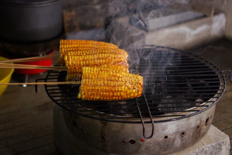 Roasting corn on the grill stock photo. Image of roast 262155346
