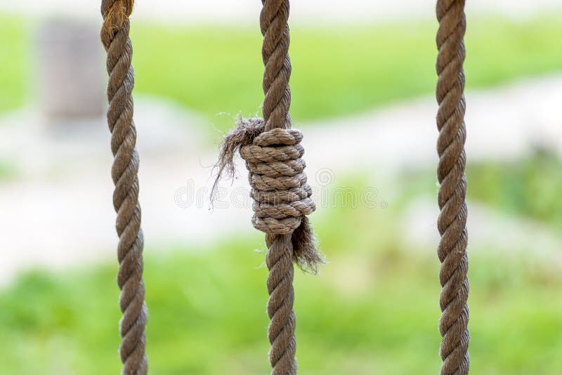 Photo of a rope knot against a grass background royalty free stock photography Photo of a rope knot against a grass background royalty free stock photography