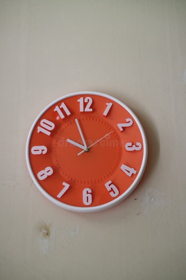 Round Orange Wall Clock with Hands Indicating 10 am Stock Image Image