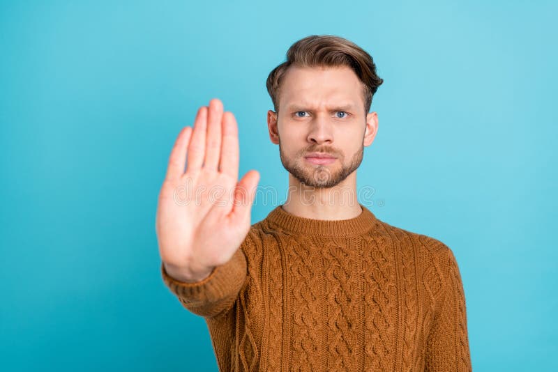 Stop hand gesture. Annoyed young man with hands up Photos