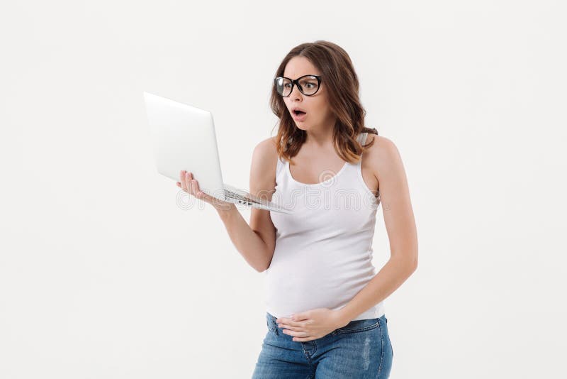 Shocked pregnant woman using laptop computer royalty free stock photos Shocked pregnant woman using laptop computer royalty free stock photos