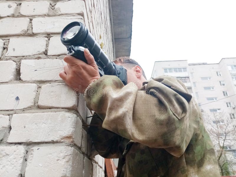 Photo shooting, photo weapons in urban environments, the photographer is hunting for a good shot stock image