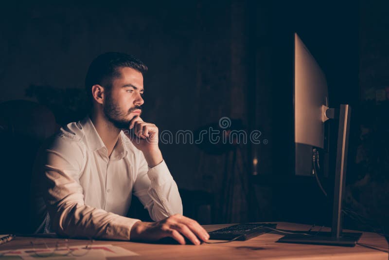 Photo side profile of serious pensive programmer working overtime interested in solving bugs arising during his work