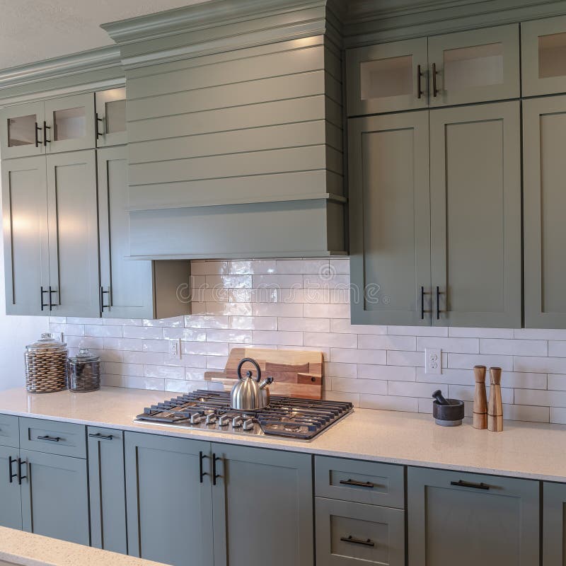 Photo Square Wooden Cabinets and White Counter Top Inside a Kitchen ...