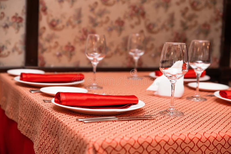 Table Setting in the Restaurant. Red Tablecloths and Napkins Stock