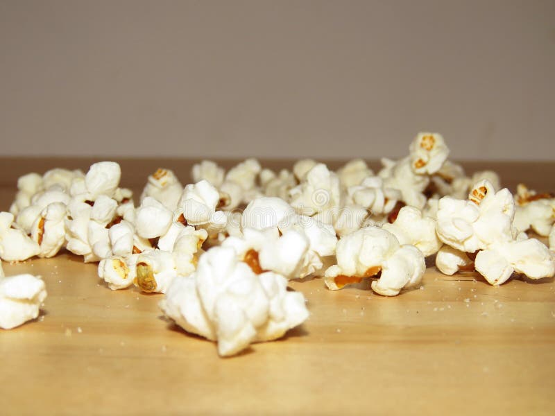 Salty popcorn spilled on the table stock photography Salty popcorn spilled on the table stock photography