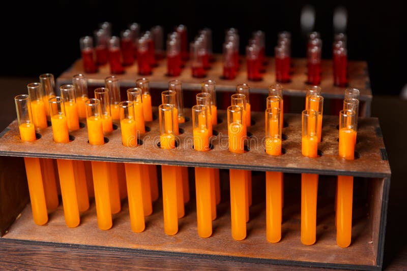 Photo of Test Tubes with Orange Liquid Stock Photo Image of chemical