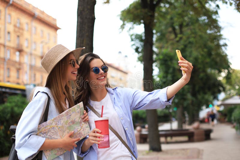 Photo Of Two Girls Enjoying Sightseeing Outdoor Beautiful Female Tourists Exploring City With