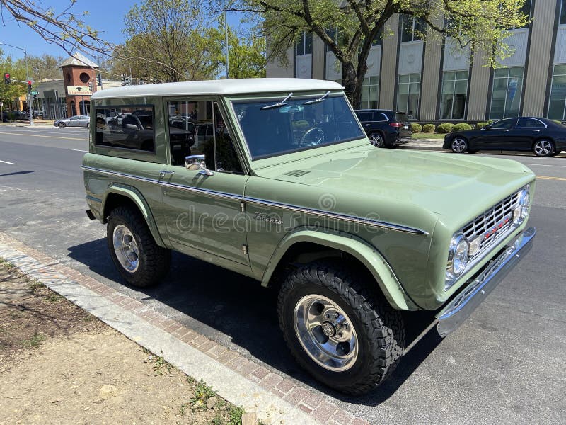 Vintage Green Ford Bronco Parked on a Street