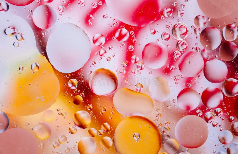 Photo of Water oil bubble macro abstract background flow liquid red orange yellow