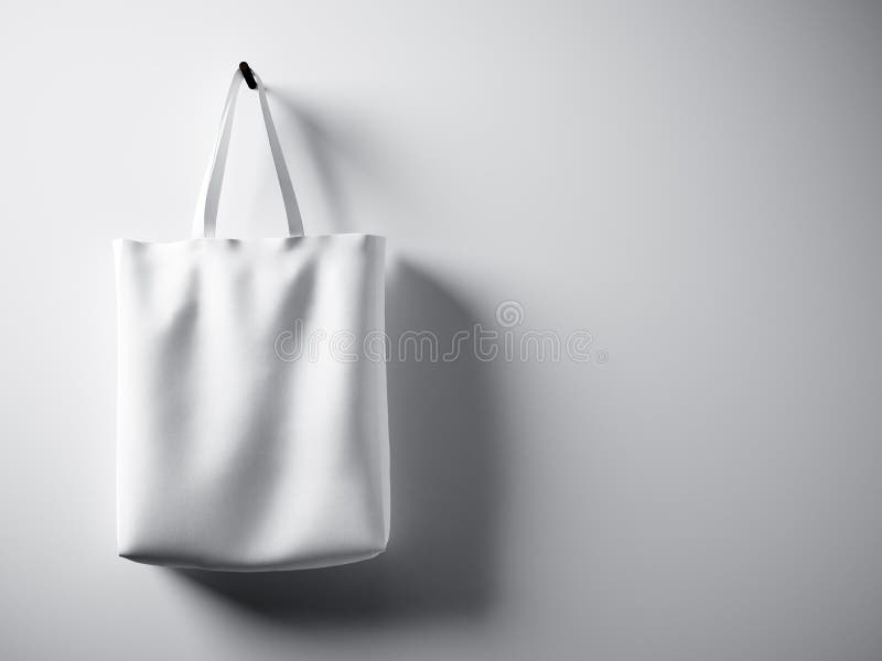 Photo white cotton textile bag hanging left side. Empty concrete wall background. Highly detailed texture, space for royalty free illustration