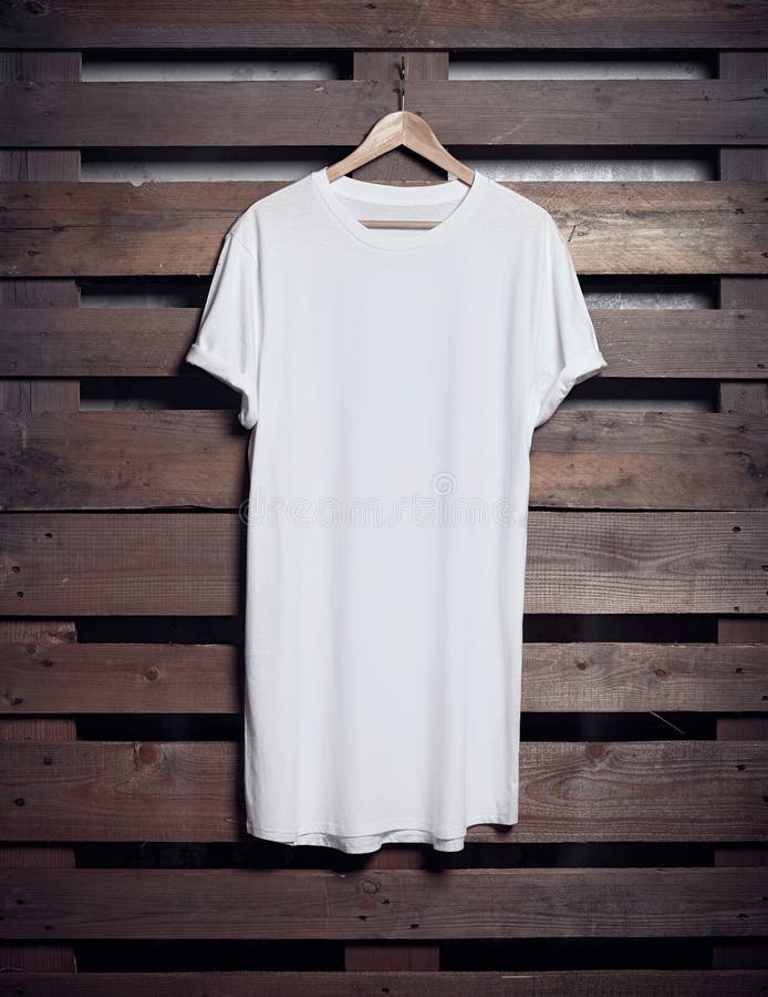 Download Photo Of White Long Tshirt Hanging On Wood Background ...