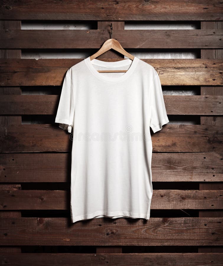 Download Photo Of White Tshirt Hanging On Wood Background Stock ...