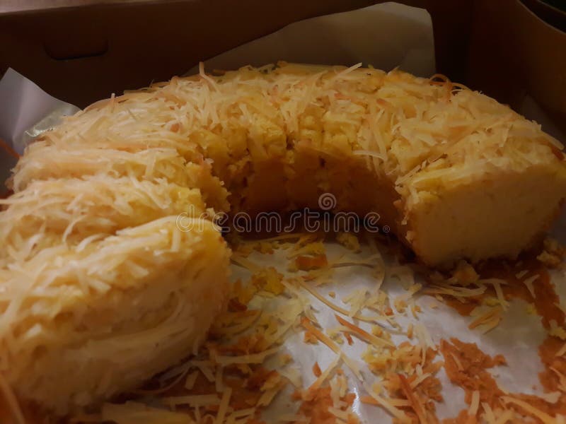 Photo of a Yellow Cheesecake on a Black Background Stock Photo Image