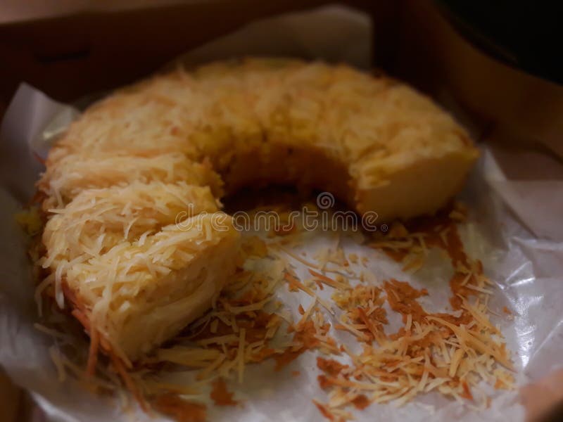 Photo of a Yellow Cheesecake on a Black Background Stock Photo Image