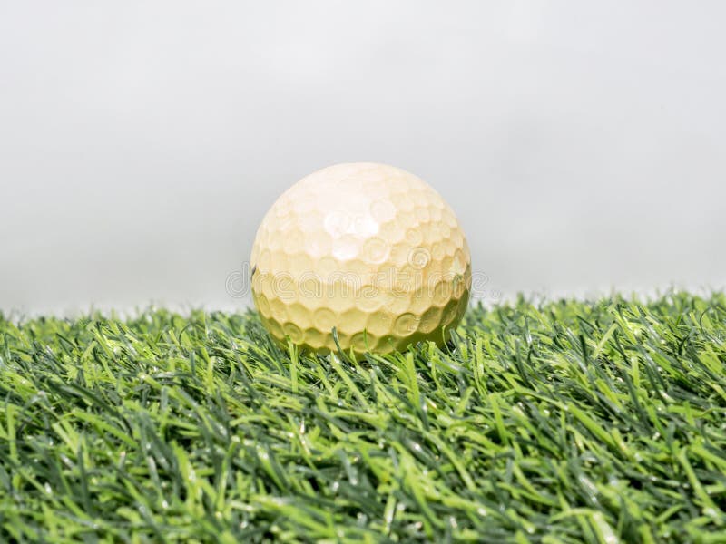 Photo Of Yellow Golf Ball On Artificial Grass With White Background ...