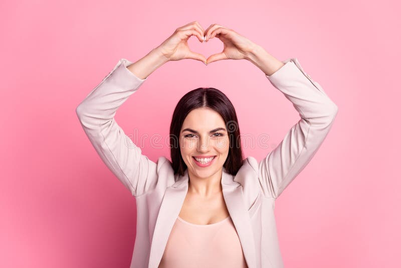 Photo of young cheerful woman show fingers love symbol valentine day isolated over pastel color background stock photos