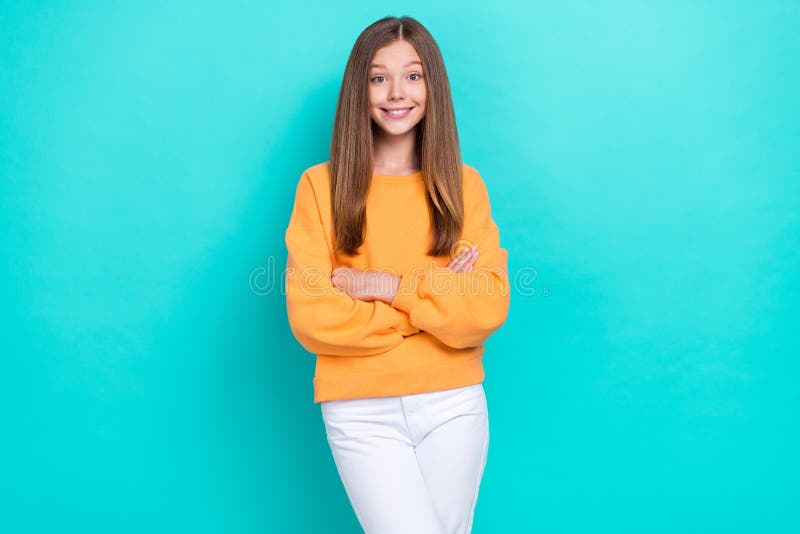 Photo of Young Funny Positive Girl Folded Arms Wear Orange Sweatshirt ...