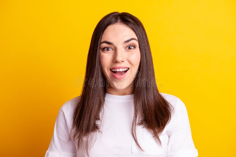 Photo of young impressed girl good news discount information wear casual clothes isolated over yellow color background royalty free stock photo