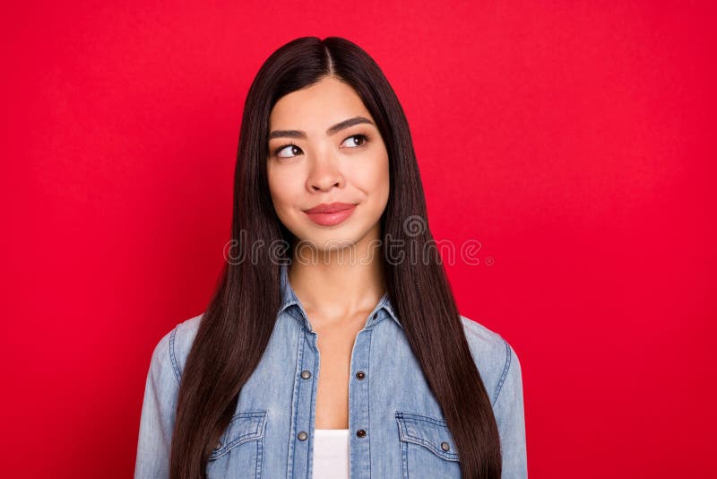 Photo of young pretty lovely chinese girl happy positive smile dream look empty space isolated over red color background