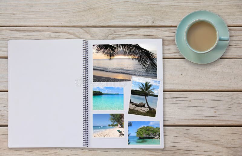 Photobook Album on Deck Table with Travel Photos Coffee or Tea in Cup