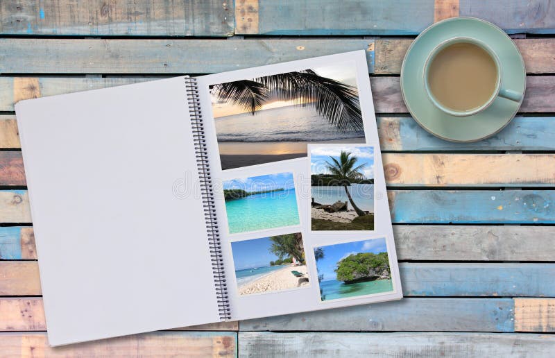 Photobook Album with Travel Photo on Wooden Floor Table with Coffee or Tea in Cup