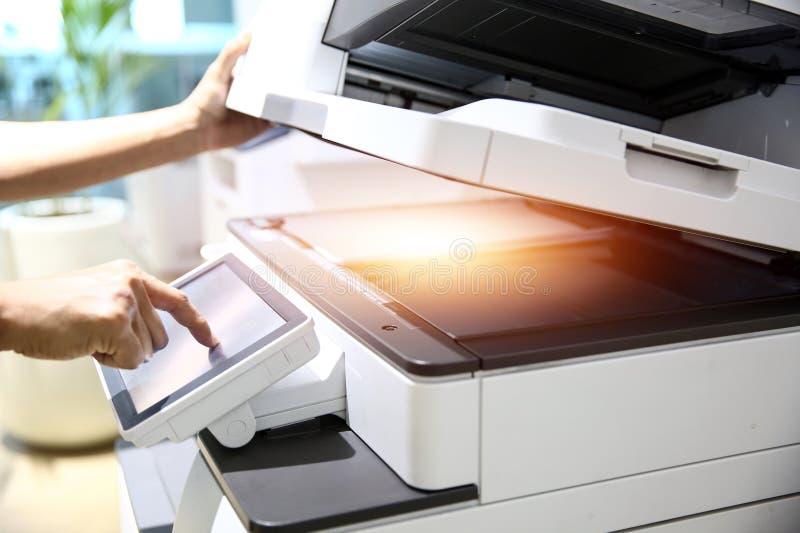 Photocopier printer, Close up hand office man press copy button on panel to using the copier or photocopy machine for scanning royalty free stock photo