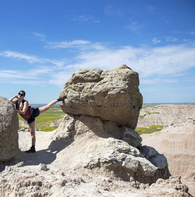 Hiker Taking a Rest to Stretch between Rocks stock image Hiker Taking a Rest to Stretch between Rocks stock image