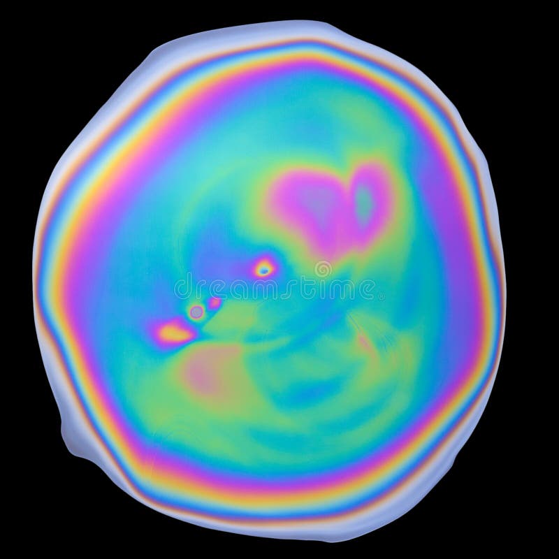 Photograph of unique abstract iridescent opalescent oil film isolated on black royalty free stock images