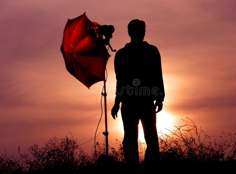 Photographe au crépuscule photo stock Photographe au crépuscule photo stock