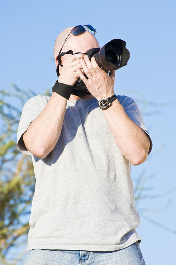 Photographer in action stock photo. Image of camera, photographer