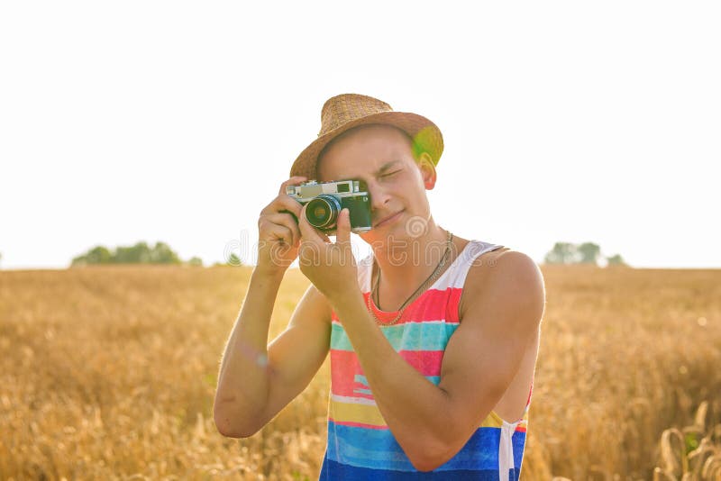 Photographer with Camera in the Field. Stock Image Image of field
