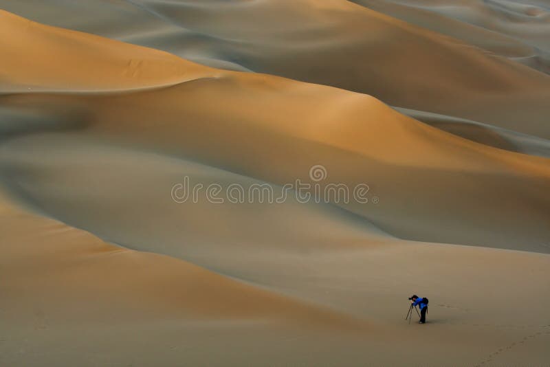 Photographer in desert