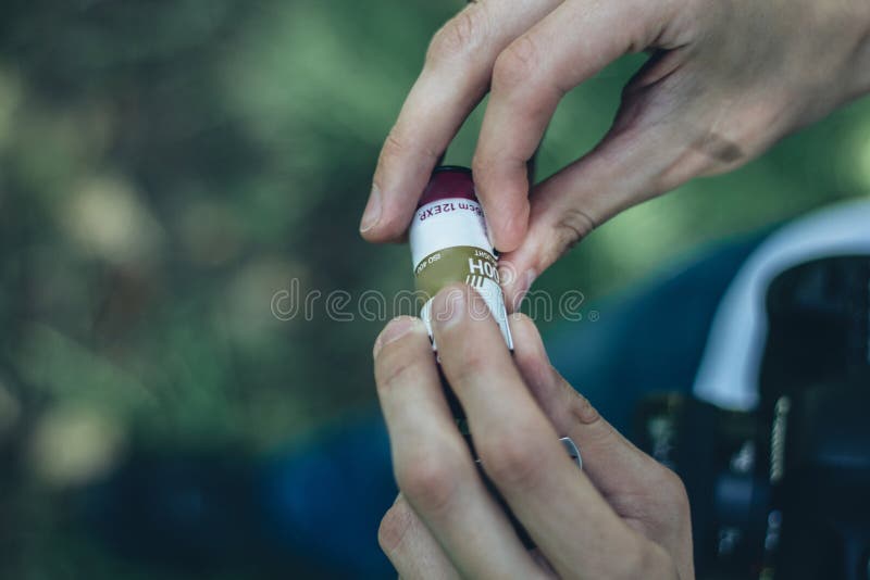 Photographer Loading Medium Format Film into the Film Back Stock Photo