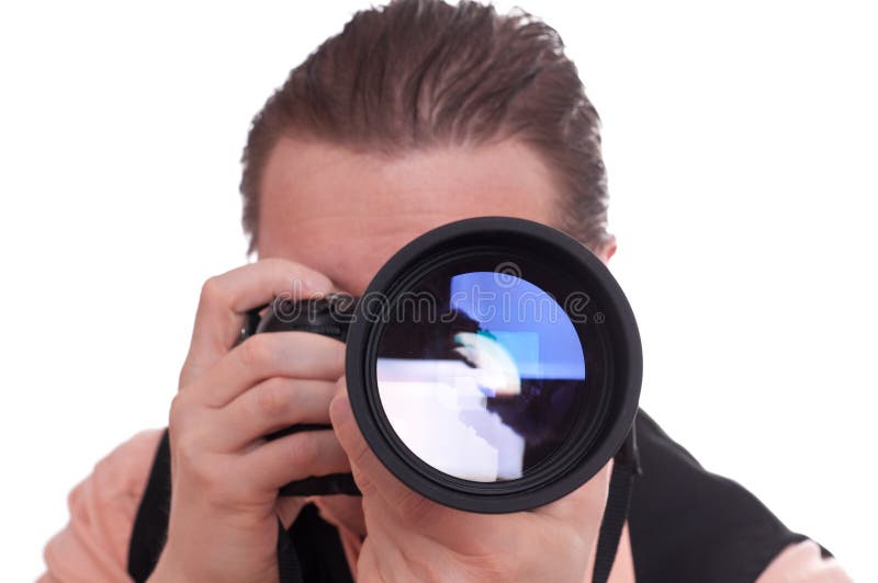 Photographer with reflex camera and telephoto lens