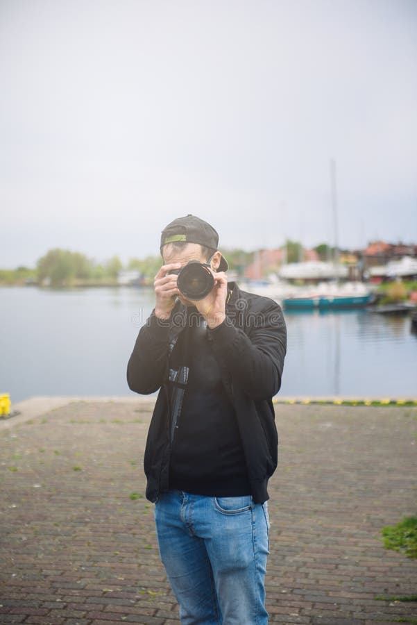 photographer taking photo of wildlife, man with camera stock photos photographer taking photo of wildlife, man with camera stock photos