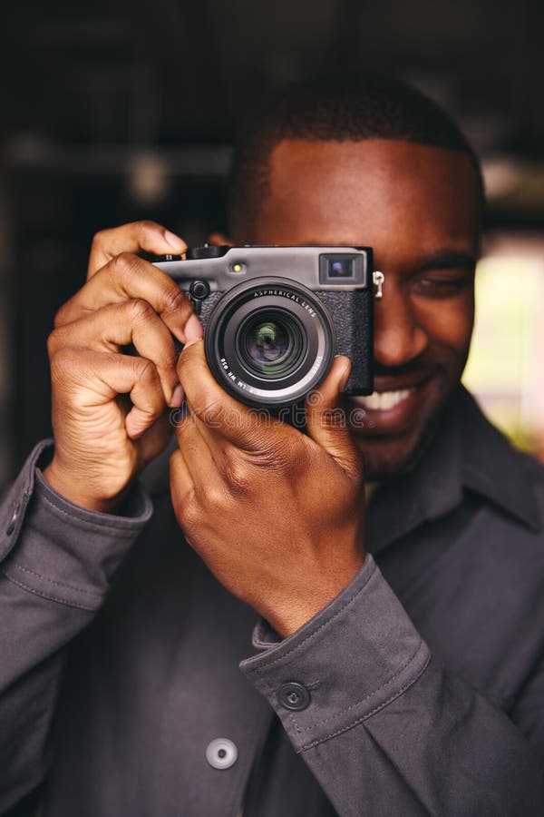 Photographer Taking a Picture with Camera Looking through Lens Stock ...