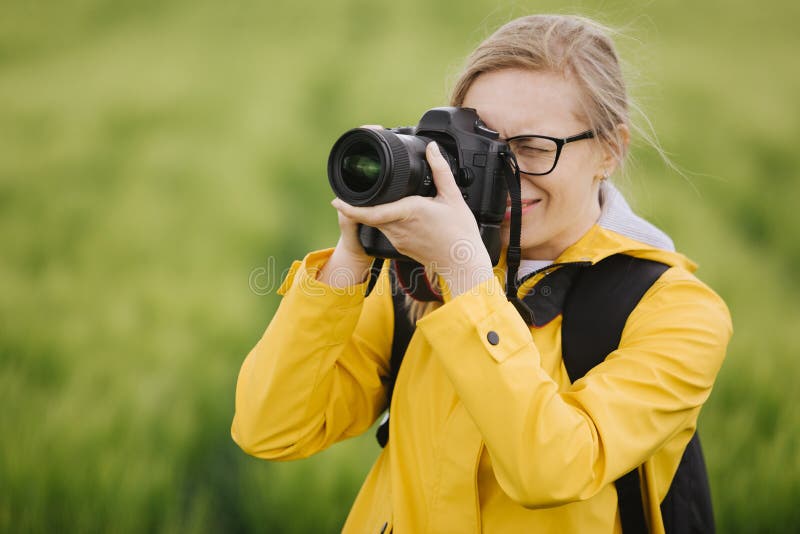 Photographer taking pictures of beautiful nature around