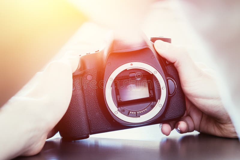 Photographer is using a professional camera, open sensor and sunlight