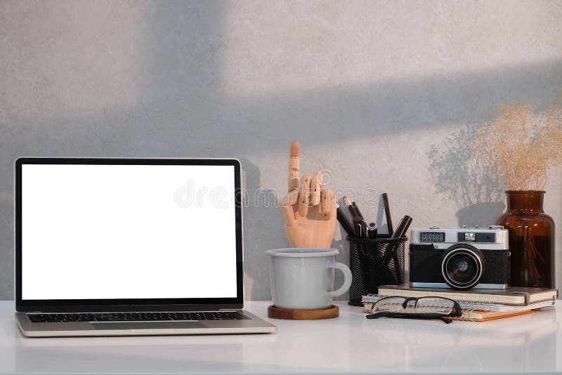 Photographer Workspace with Laptop Computer, Camera, Coffee Cup and