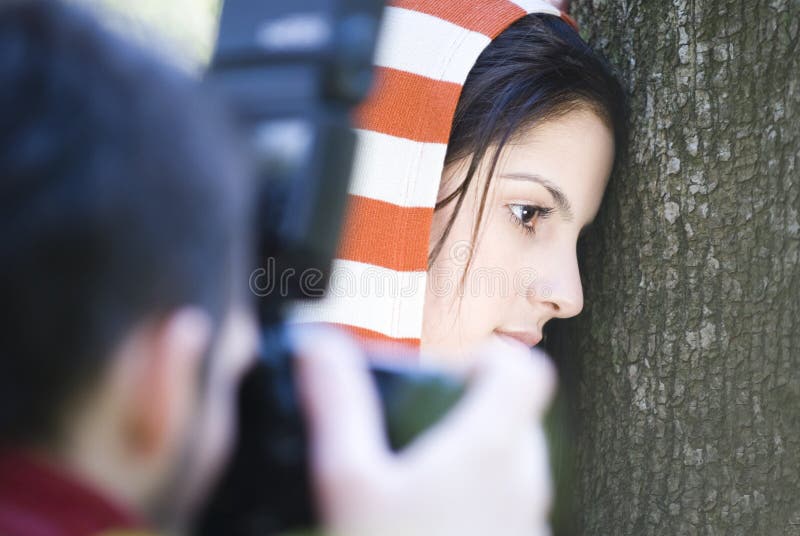 Photographing brunette woman