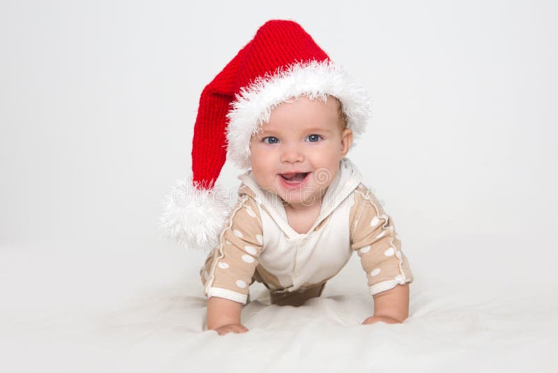 Photos de jeune bébé dans un chapeau de Santa Claus photos stock Photos de jeune bébé dans un chapeau de Santa Claus photos stock