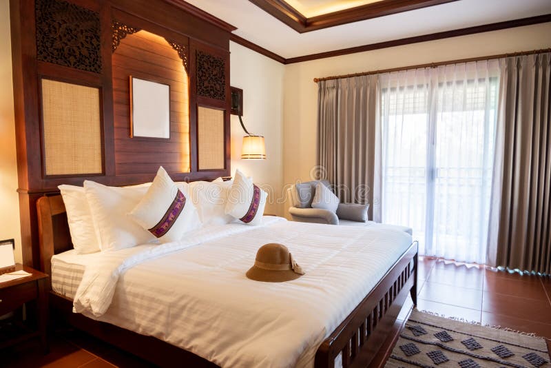 Photos of Hats Placed in the Bed of a Comfortable Room in the Hotel