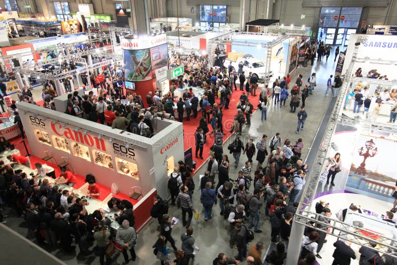 Panoramic view of people crowd visiting Canon stands at Photoshow, international photo and digital imaging exhibition on March 26, 2011 in Milan, Italy. Panoramic view of people crowd visiting Canon stands at Photoshow, international photo and digital imaging exhibition on March 26, 2011 in Milan, Italy.