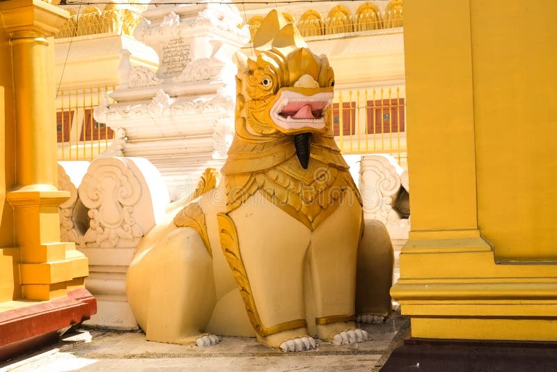 A statue of a lion head Watching the entrance to the pagoda. stock photo A statue of a lion head Watching the entrance to the pagoda. stock photo